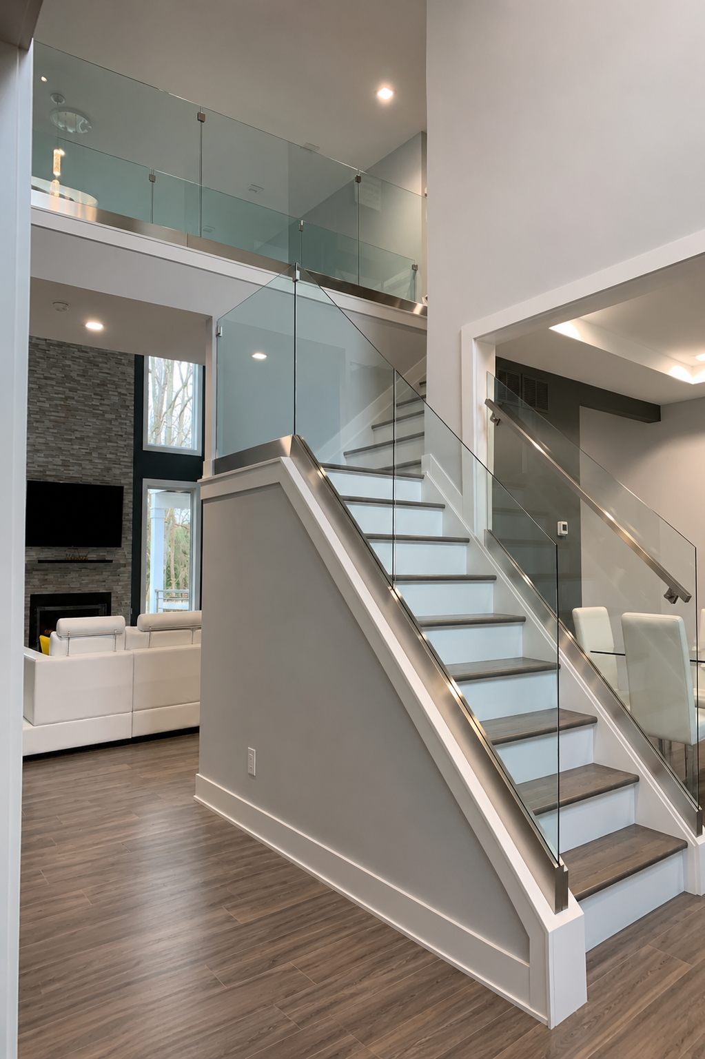 Custom glass stair railing installed by Michael’s Glass Company in Philadelphia area home